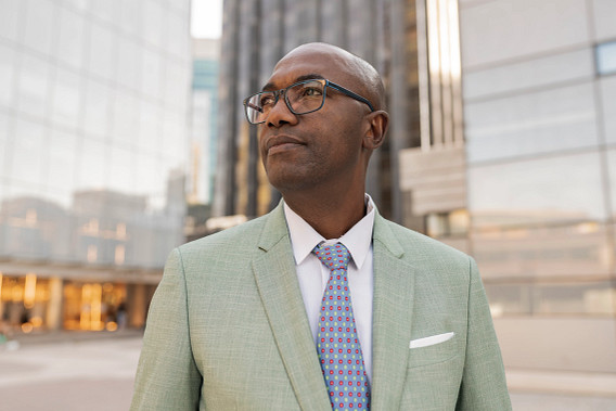 man in suit outdoors in city