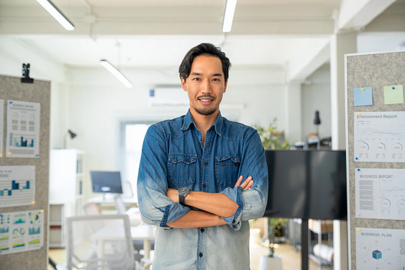 Man looking to camera with arms crossed