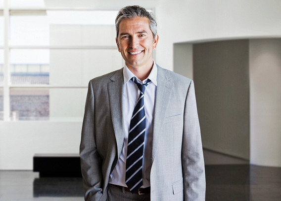 smiling male office worker looking to camera