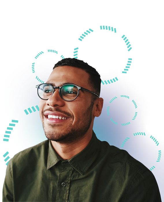 A man in a green shirt and glasses smiling